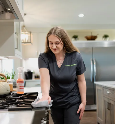 Team Member Wiping Stove